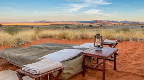 Tok Tokkie Trail outdoor bed setup, inviting under the starlit desert sky.