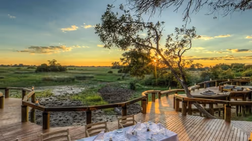 Spectacular sunset view over the bush from your lodge in the Okavango Delta.