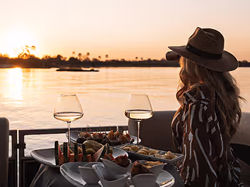 A woman sitting overlooking The Zambezi River
