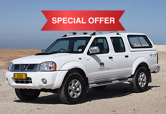 Our 4x4 double cab Namibia Car Rental vehicle in the desert of Swakopmund