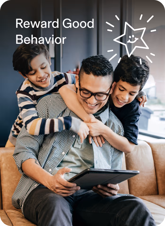 Bonus Time image showing happy father with is two smiling sons browsing the internet on an Aura protected tablet.