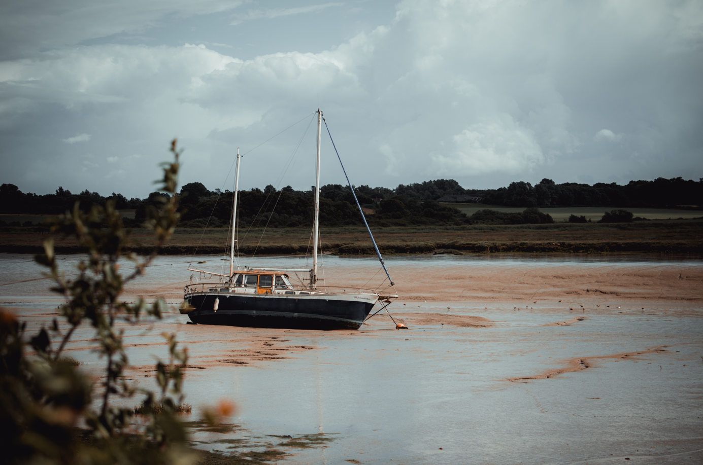 Beached Boat in clay marshland
