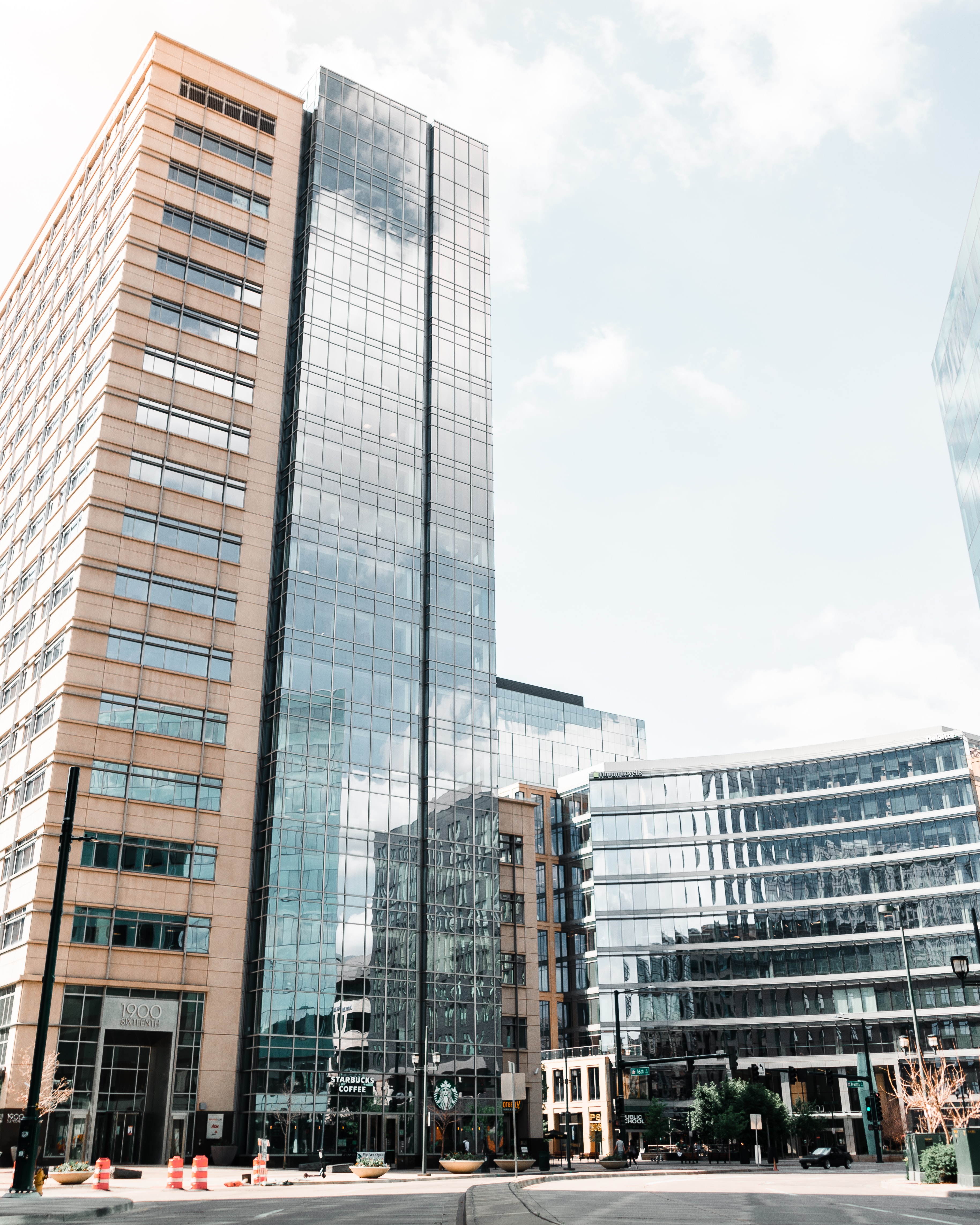 Tall glass buildings in the middle of a city.