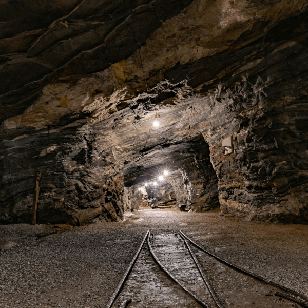 Explore the mysterious depths of Passagem de Mariana, MG, Brazil, with this illuminated underground mine tunnel.