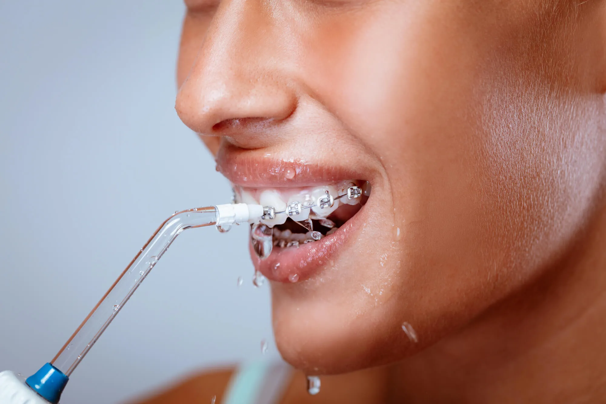 patient brushes teeth as advised by her Dentist in Candler NC