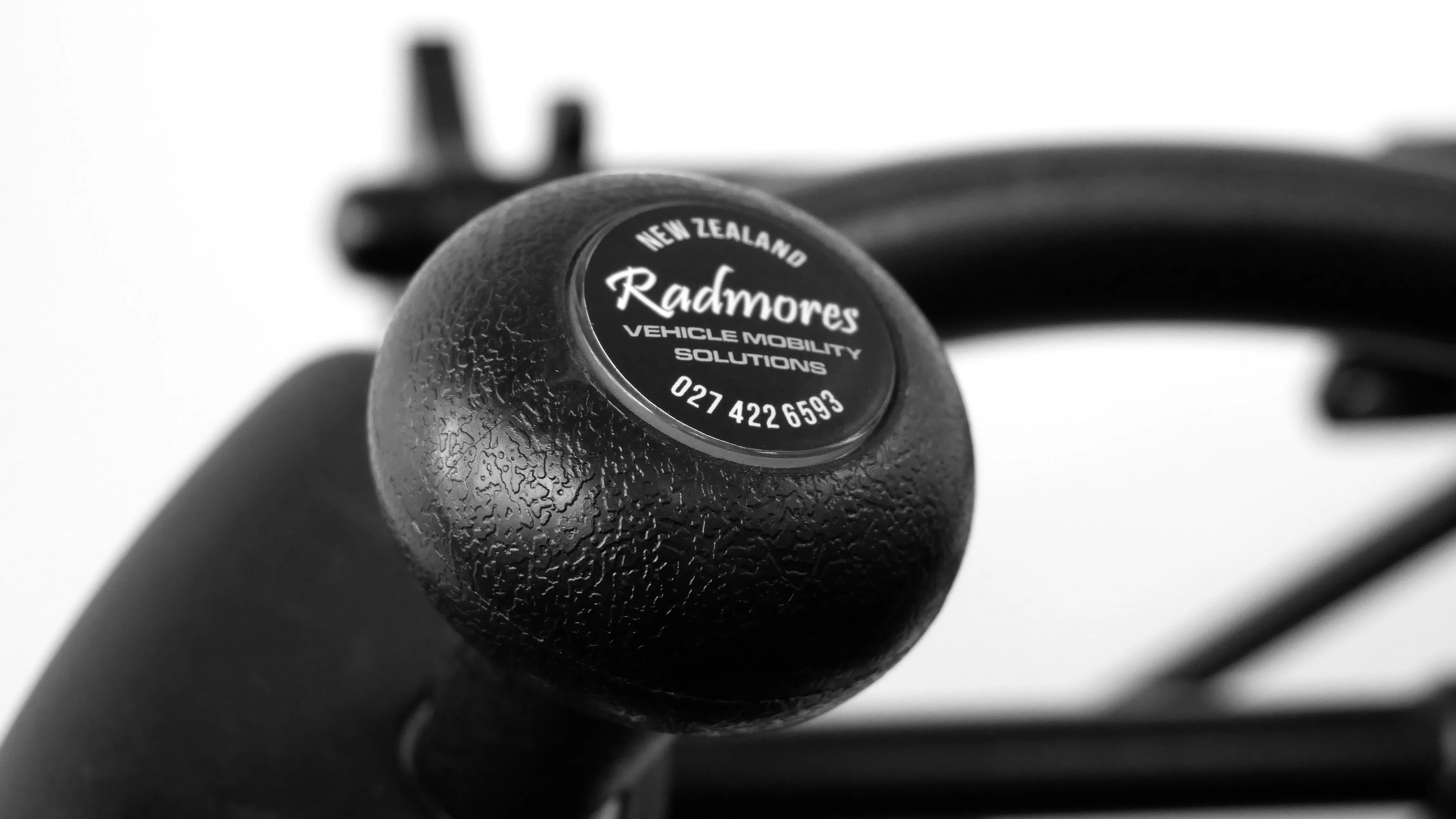 A hand spinner showing the Radmores logo.