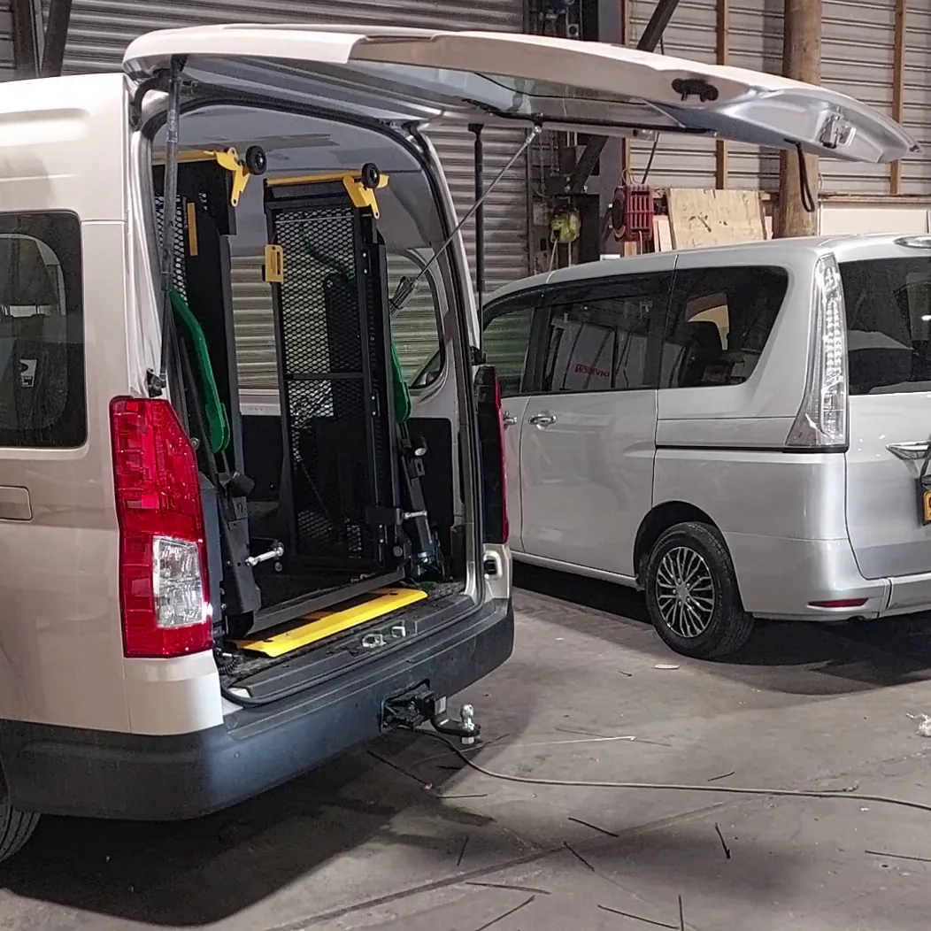 A rear entrance remotely operated hydraulic boot lifting system