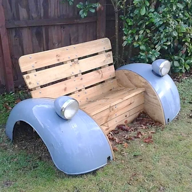 A wooden bench made from the front of an old car.