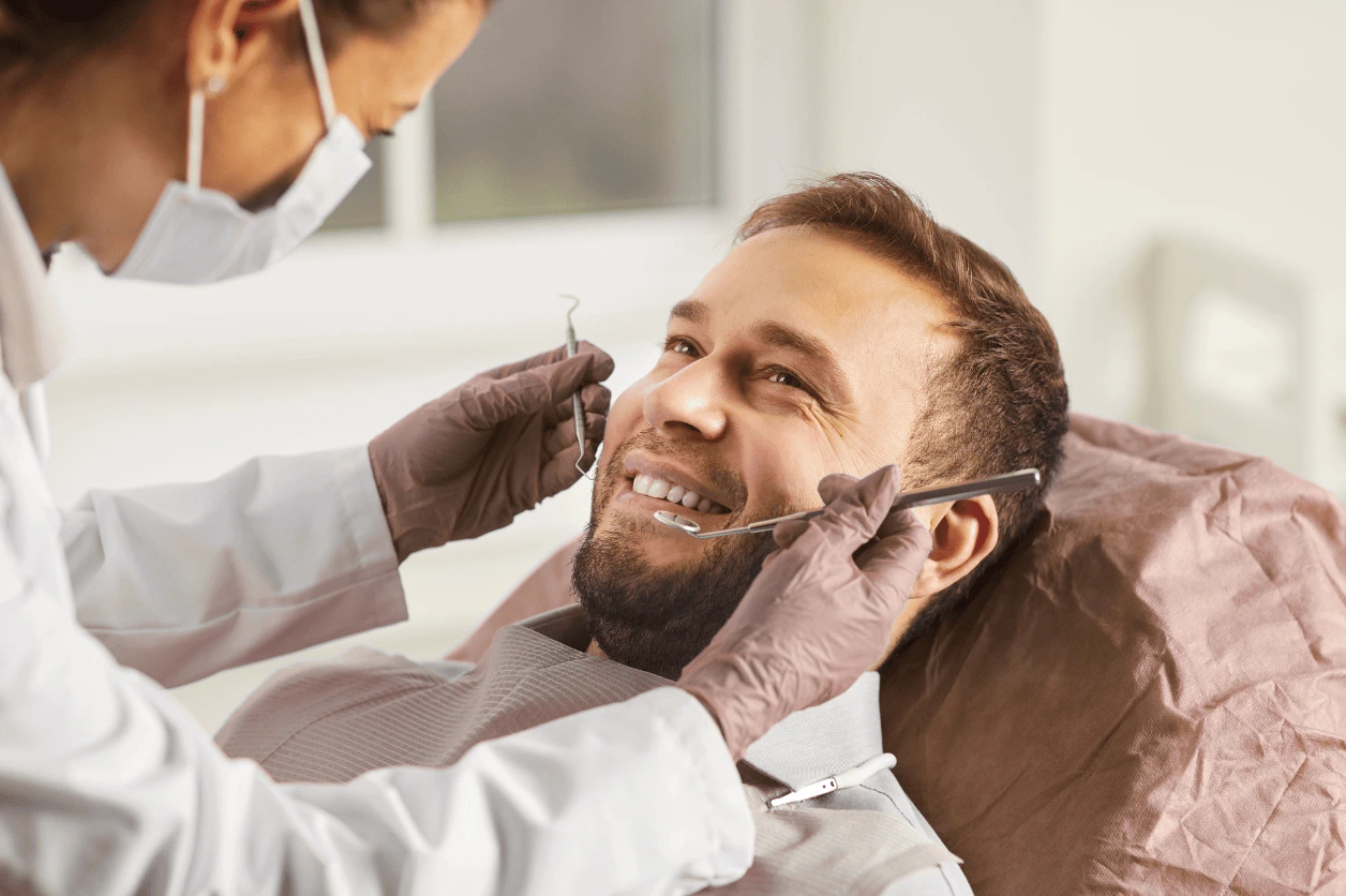 Person smiling with clean, healthy teeth.