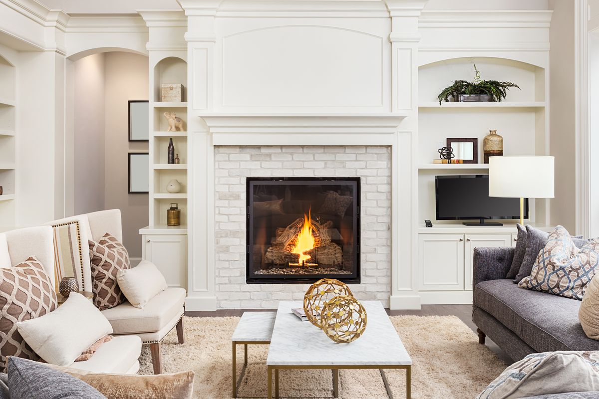 Refinished fireplace mantle by Finishline Cabinets