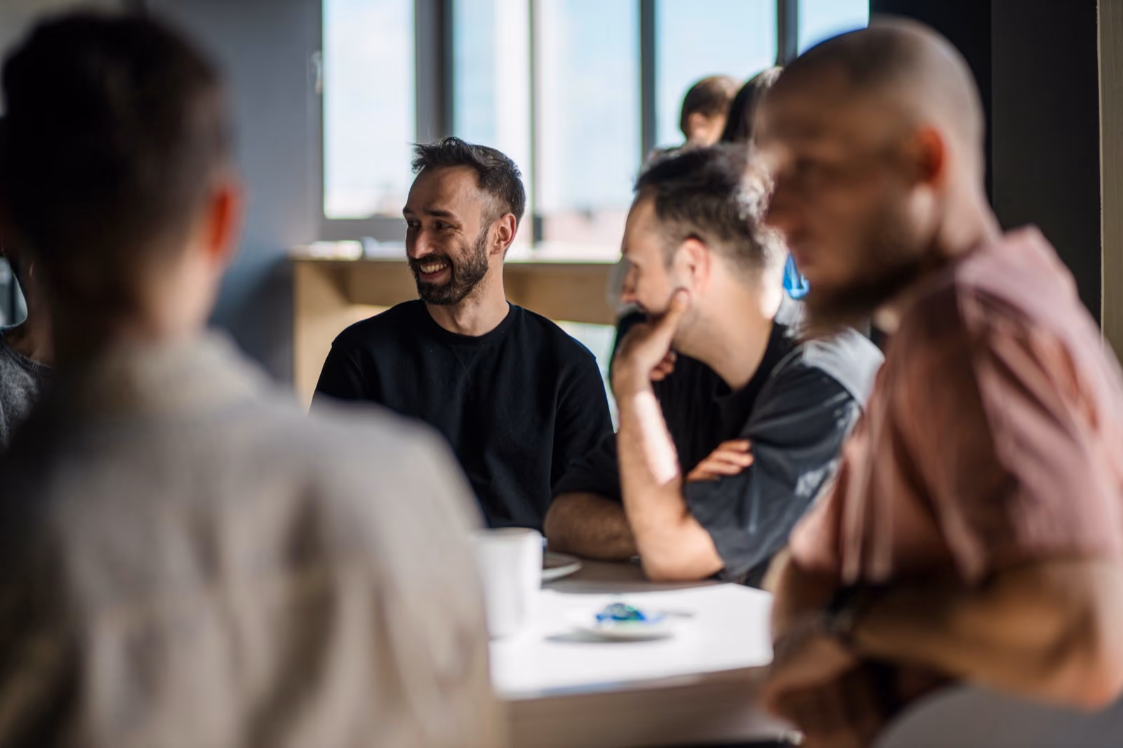 STX Next team members in conversation at the office