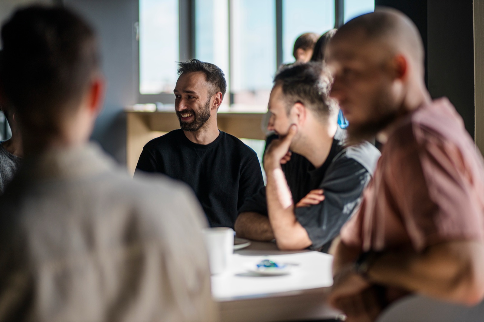 STX Next team members in conversation at the office