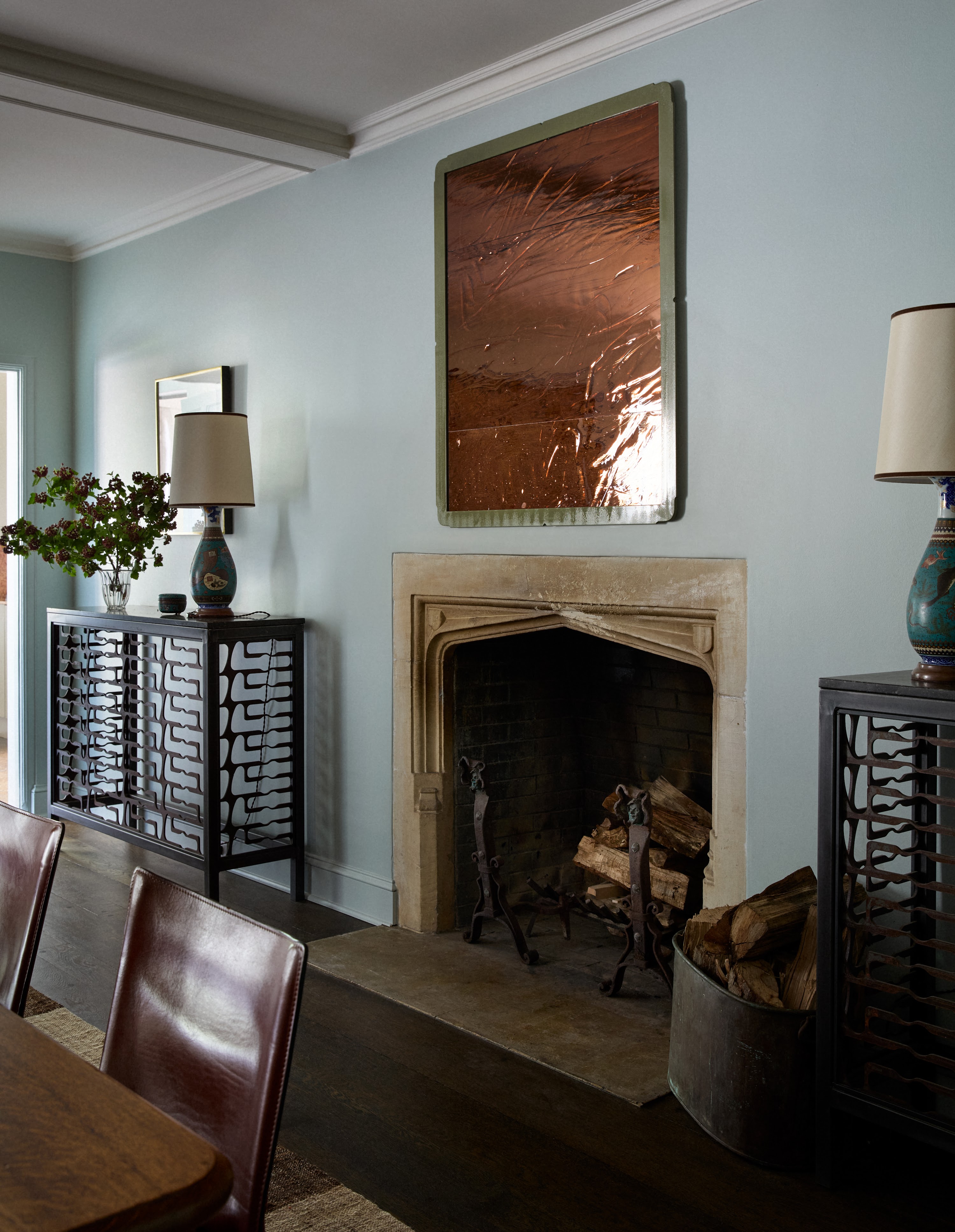 Fireplace and artwork in the Upstate New York dining room
