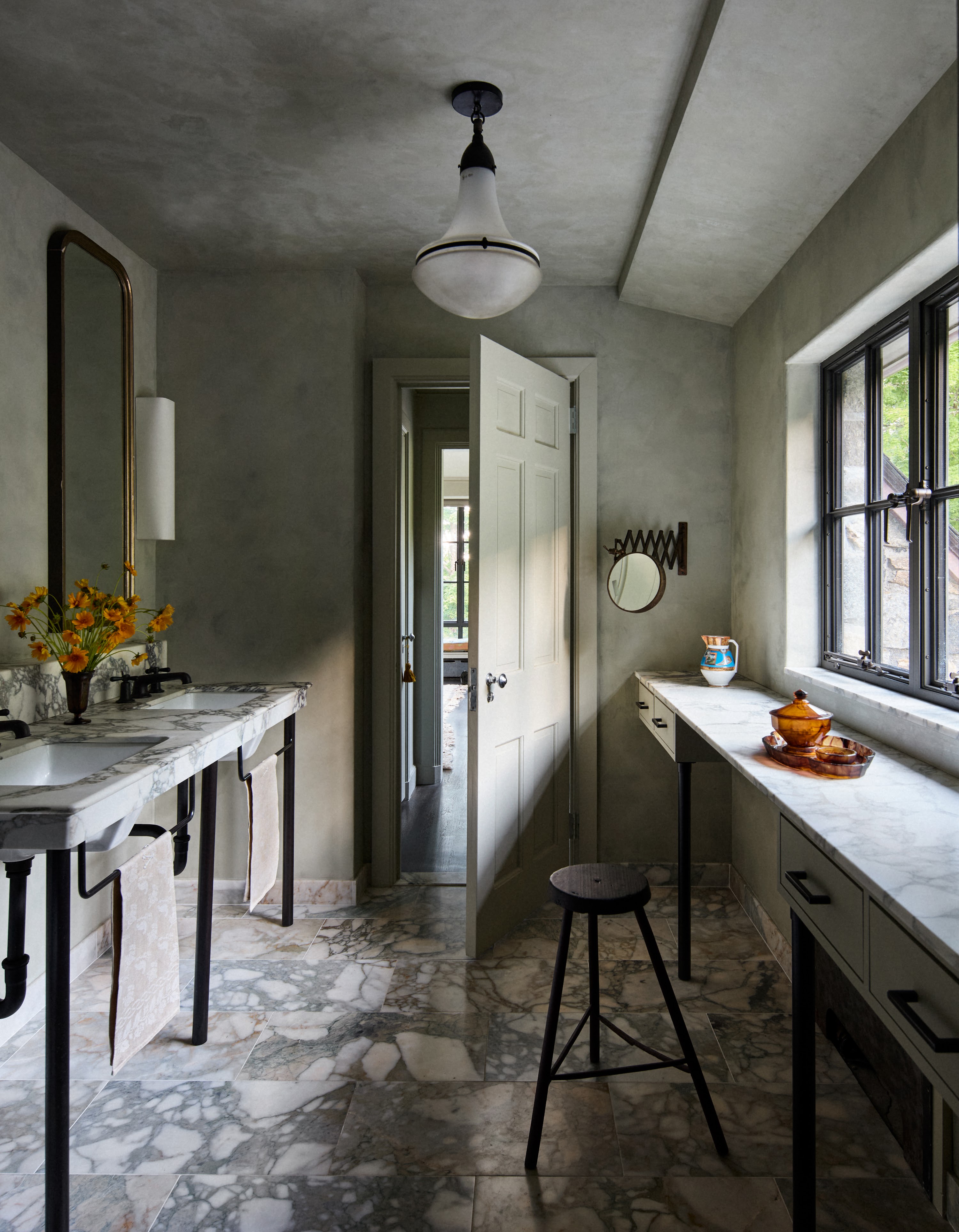 Upstate New York bathroom with patterned flooring and a long counter