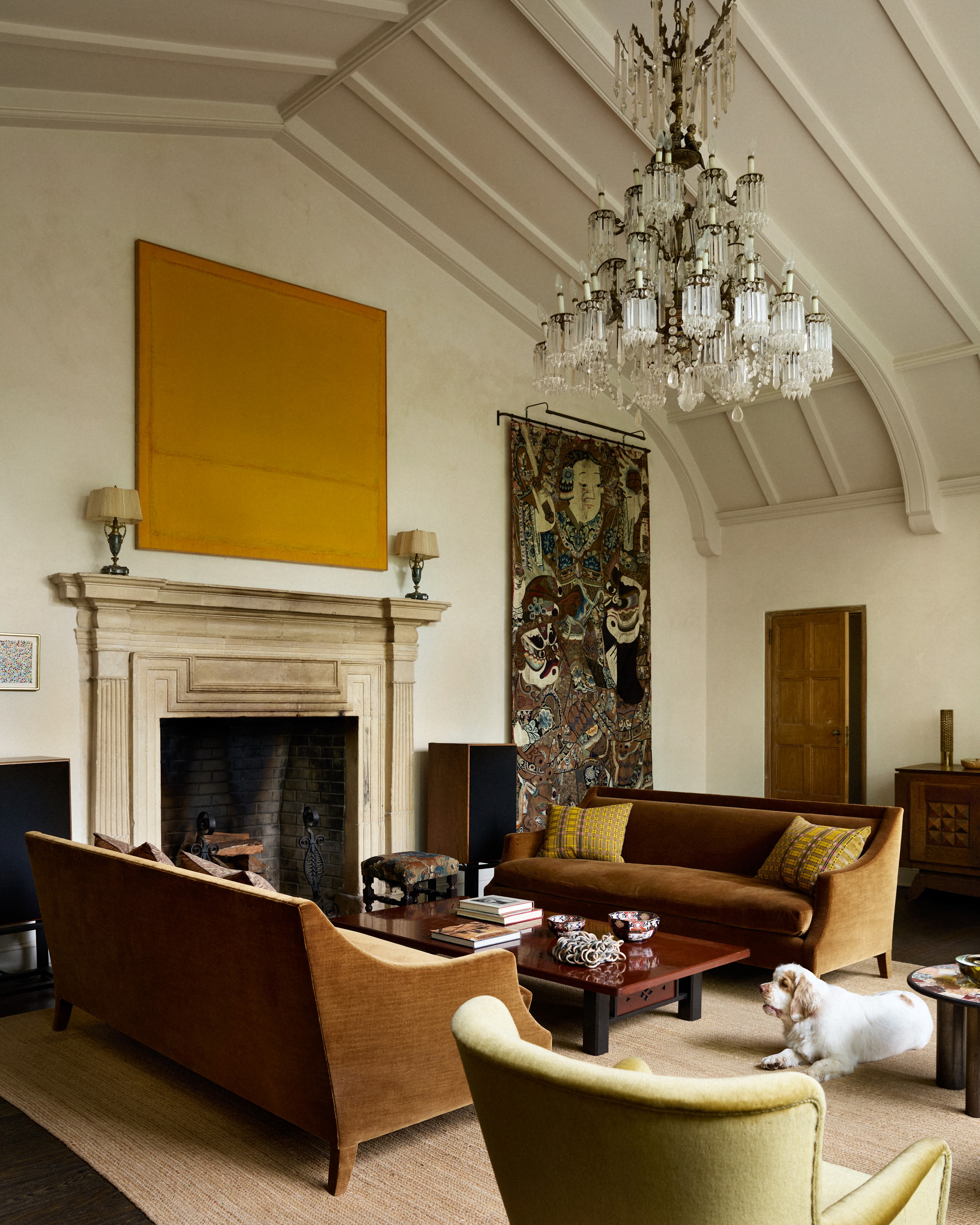 Upstate New York living room with a fireplace and chandelier