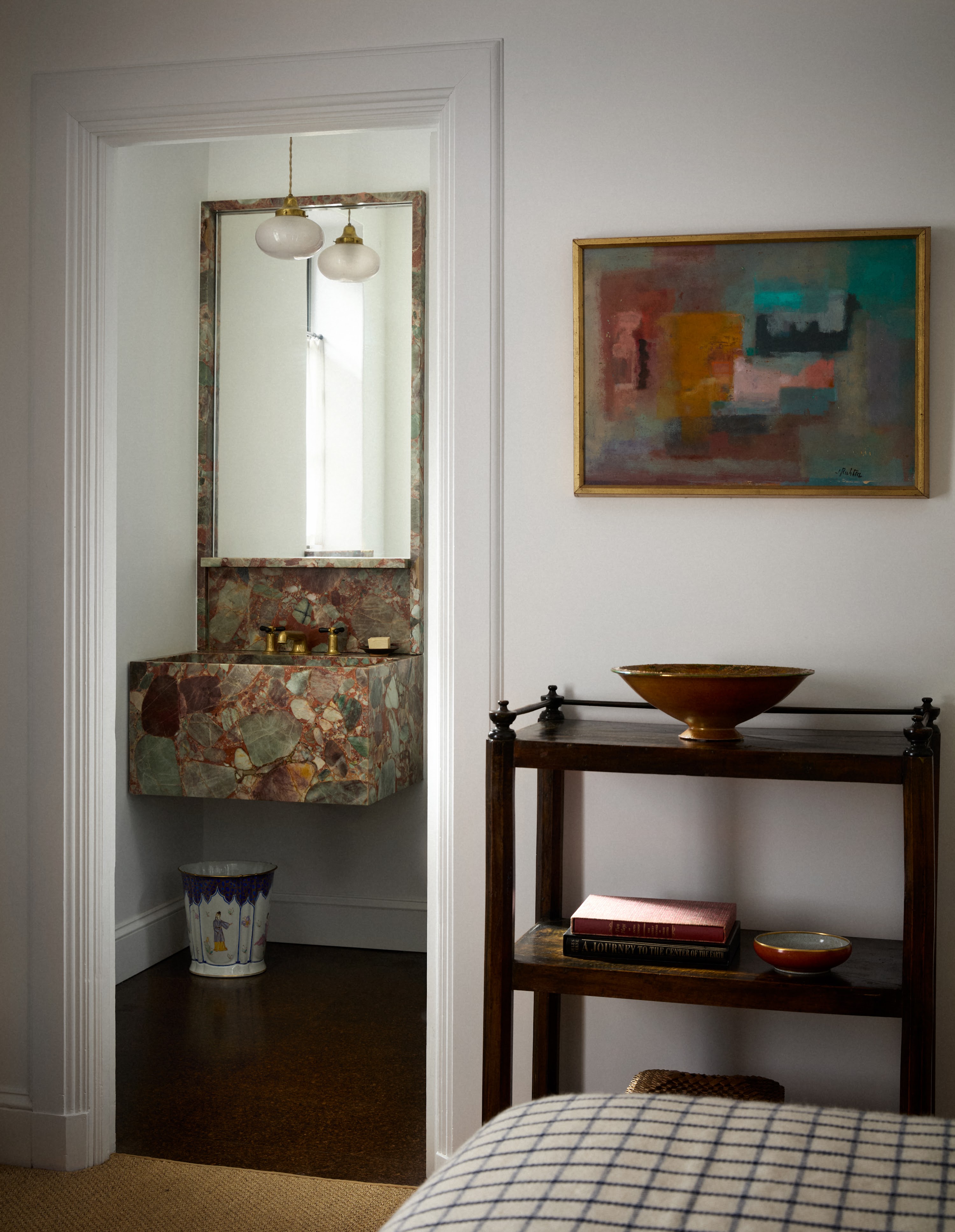 Bathroom doorway and small console in the Upstate New York home