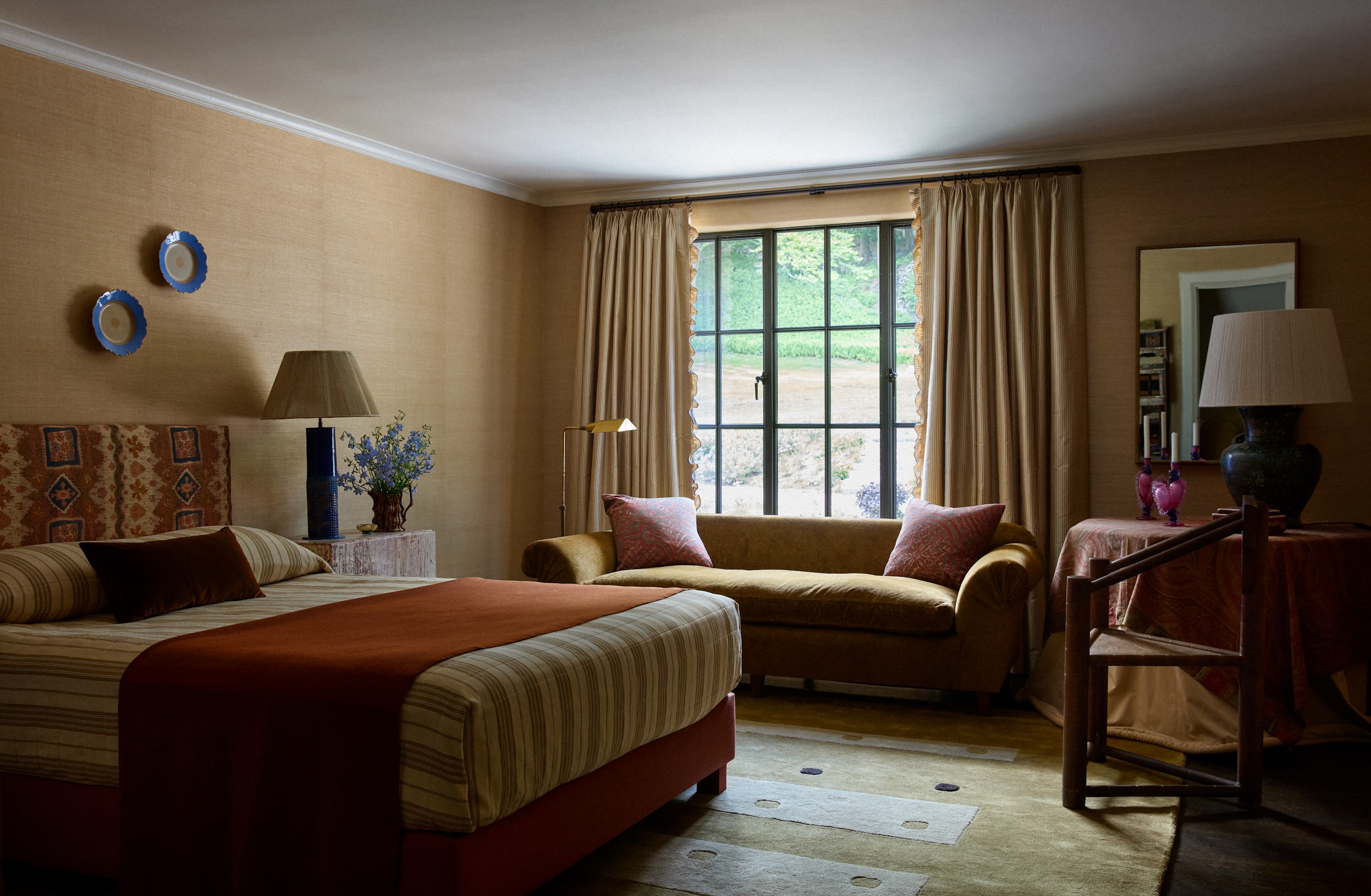 Upstate New York bedroom with a seating area by the window
