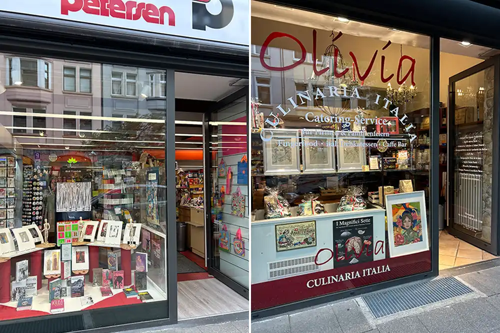 Rü Art Kunstmeile Essen: Schaufenster von Papeterie Petersen und Olivia Culinaria Italia mit ausgestellten Kunstwerken.