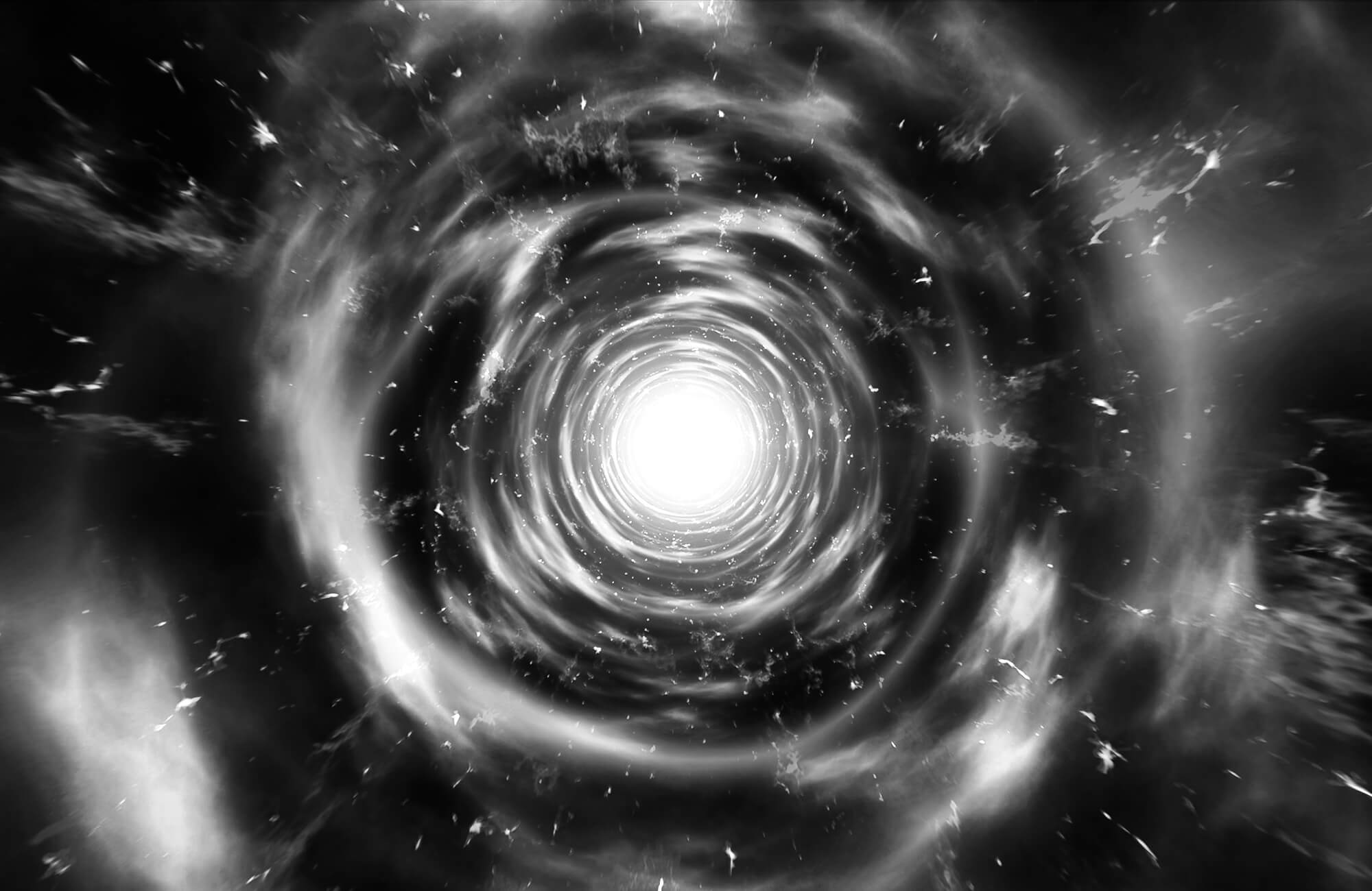 Swirling cosmic vortex with bright light at the center.