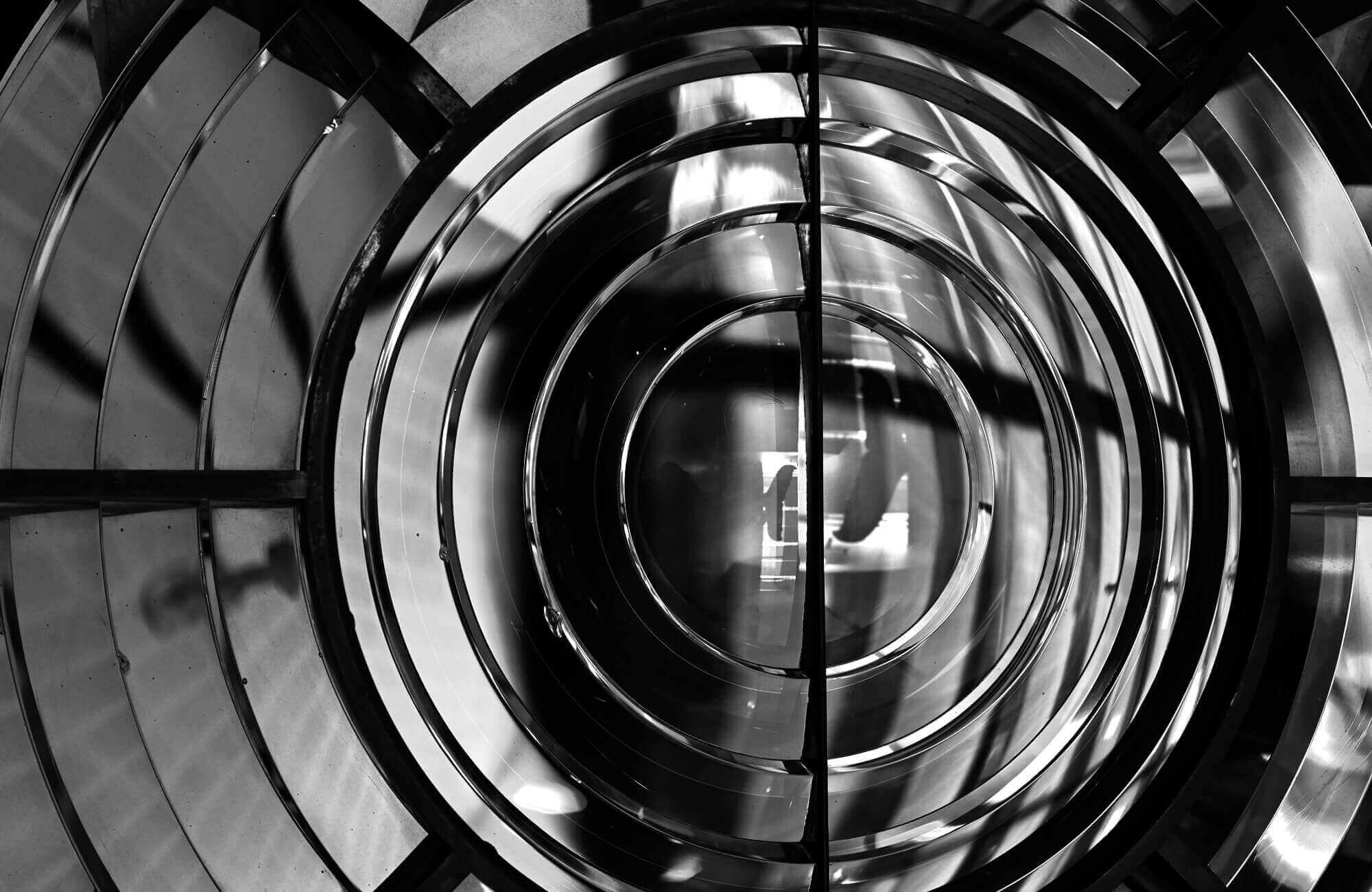 Photo of concentric circular metal rings with light and shadow patterns.