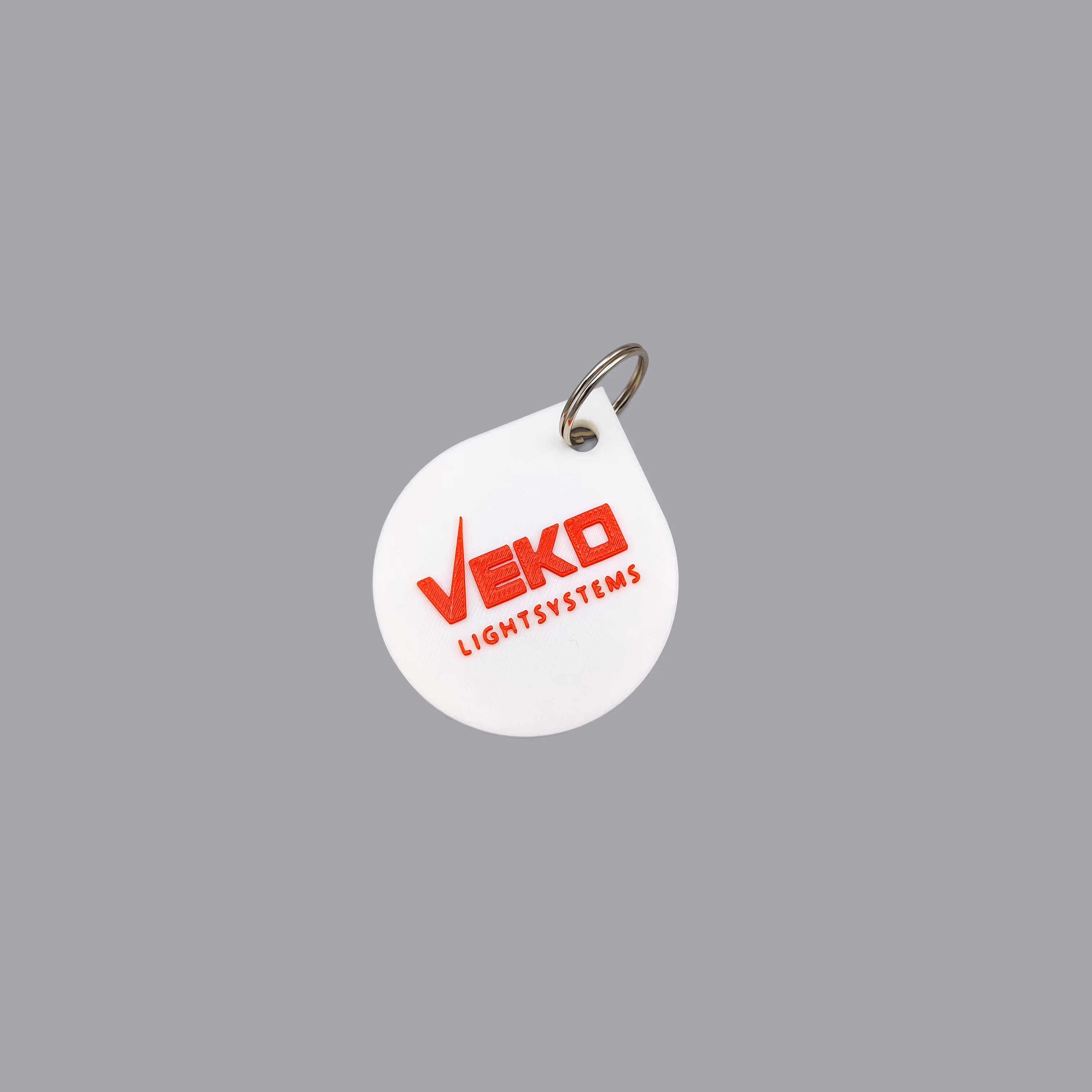 Relatiegeschenk-sleutelhangers met Veko-branding, vervaardigd in PLA door Antistatic
