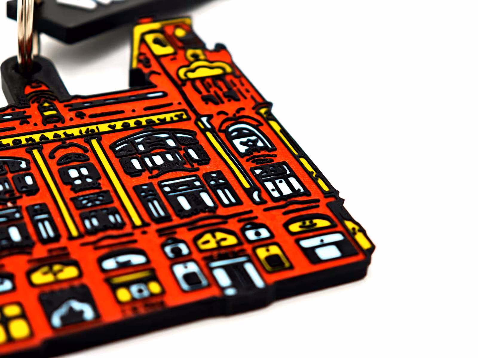 close-up van de sleutelhangers in de vorm van de facade van de vooruit in Gent. 3d geprint door antistatic bv