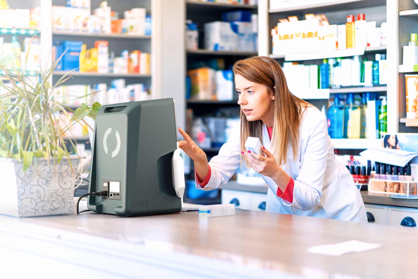Pharmacist preparing to use the ViBo Health DigiScan.