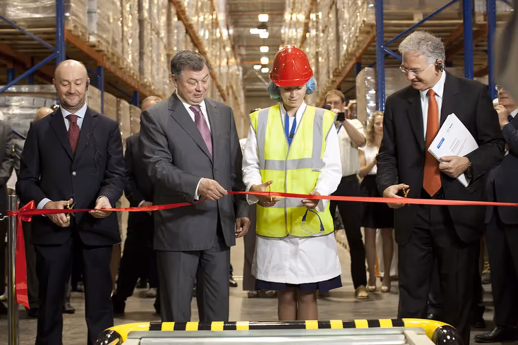A photo of a ribbon-cutting ceremony after a project's final completion.