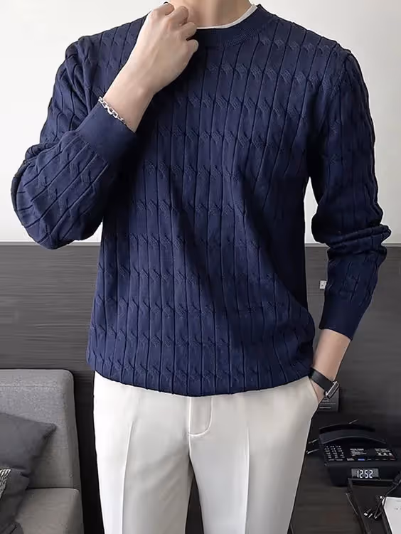 Business Casual Dress Code for Client-Side Project Managers: An image of a man wearing a navy colored sweater.
