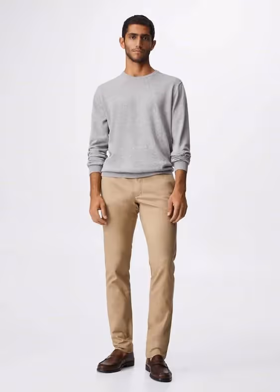 Business Casual Dress Code for Client-Side Project Managers: A photo of a man wearing khaki pants.