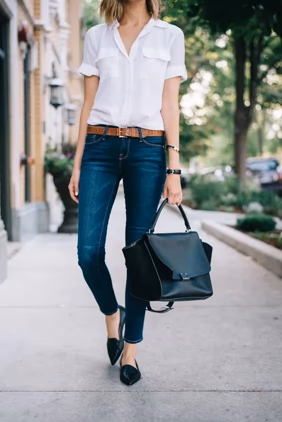 Business Casual Dress Code for Client-Side Project Managers: A photo of a woman wearing a white blouse.
