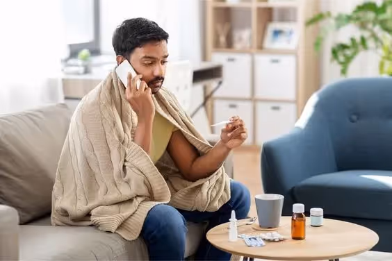 How to Call in Sick as a Project Manager: A photo of a Project Manager calling in sick to work.