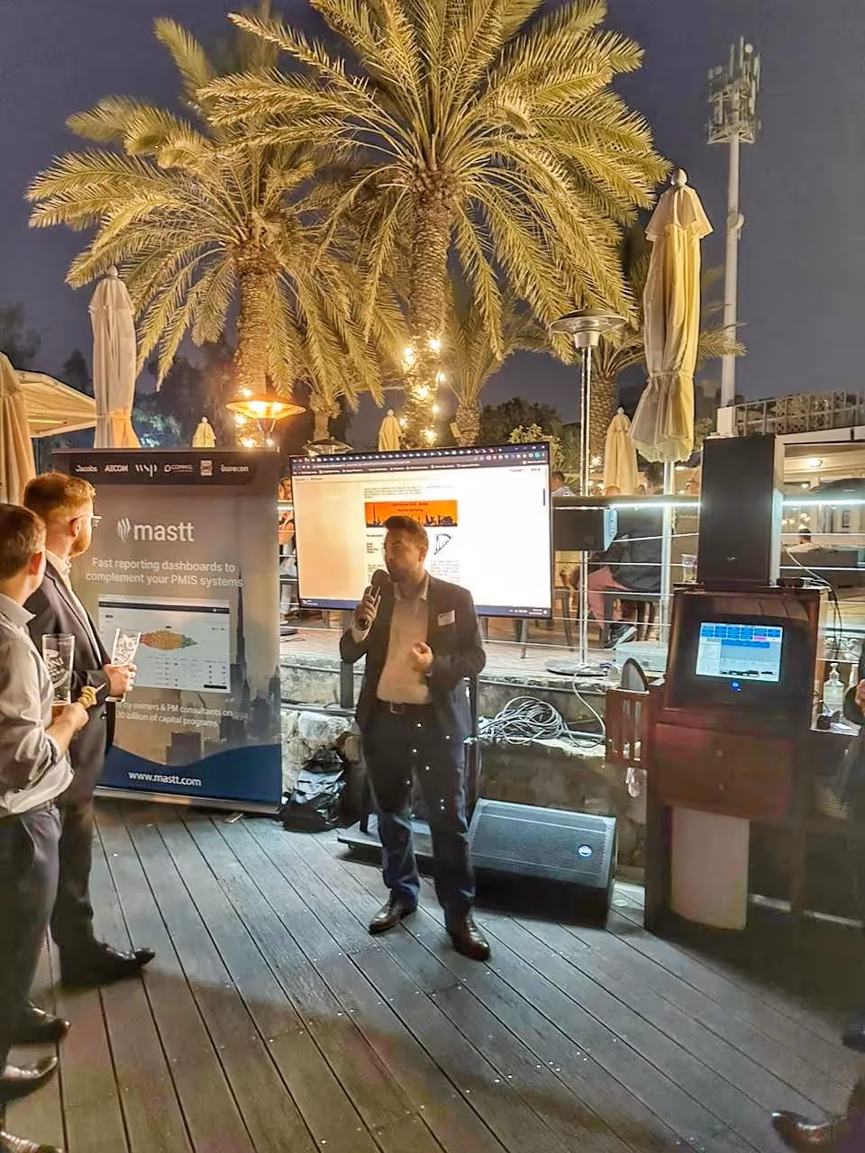 Meet Ezzeddin, Our Team Member in Dubai, UAE: A man speaking in front of a public audience in a networking event