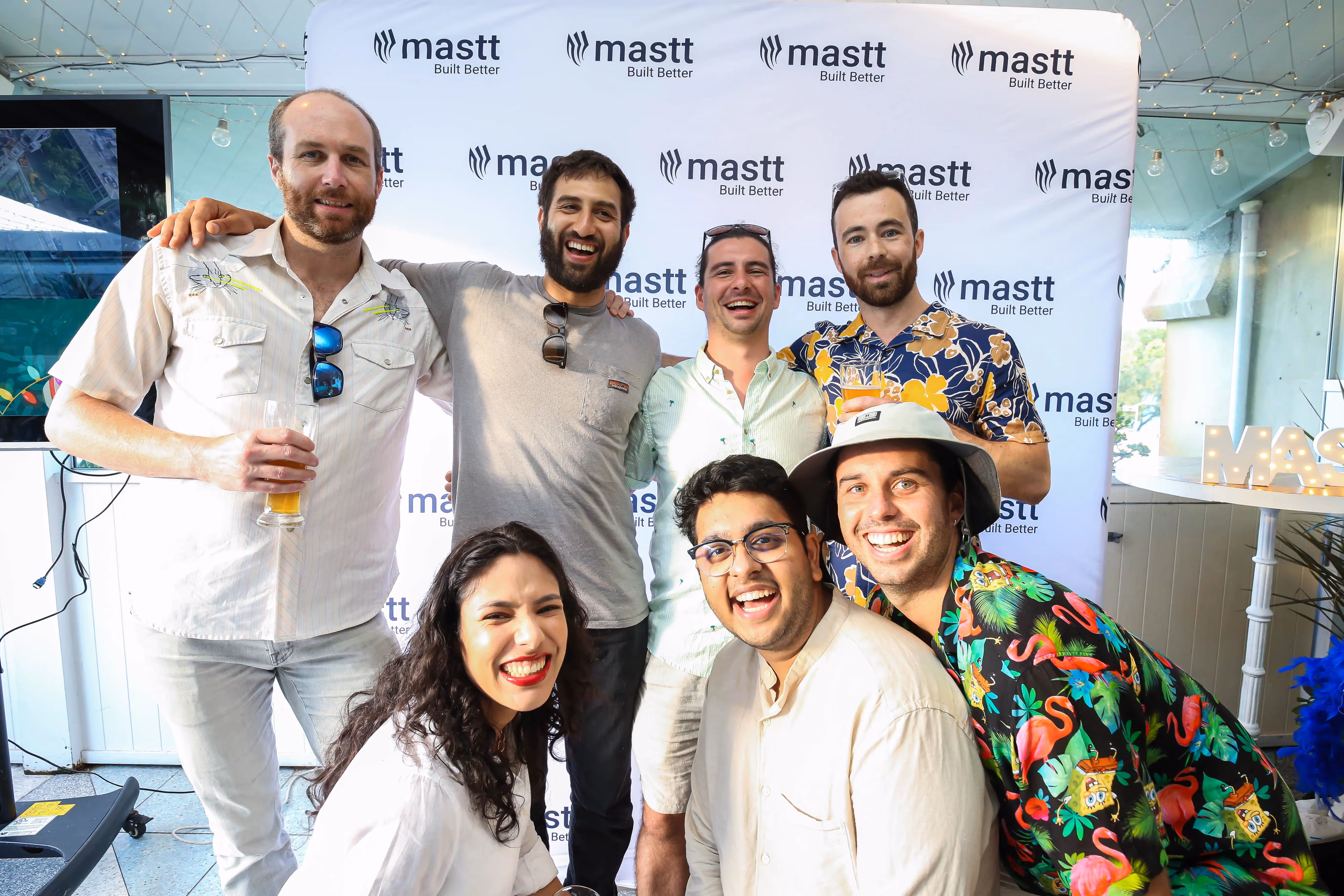 Mastt Named One of Australia's Best Places to Work in 2022: A group of professionals at a company party