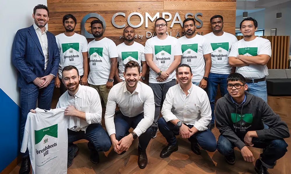 Meet our first MENA customer: Compass Project Consulting: A group of project management professionals in front of a wall