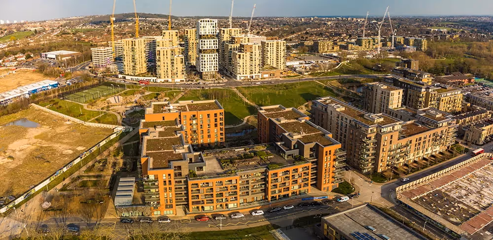 Aerial view of a mixed-use development project with residential buildings.