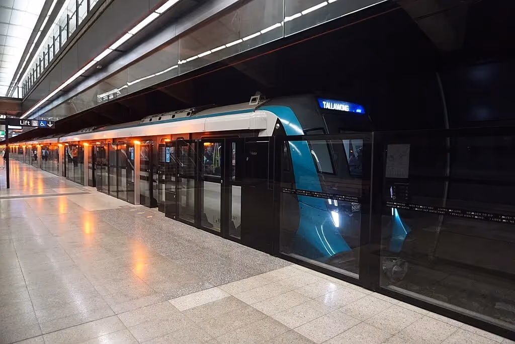 Modern metro train at an underground station in New South Wales, ready for boarding.