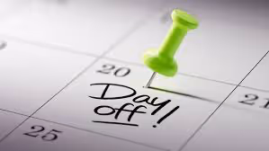 What is RDO? Understanding Rostered Days Off and Their Impact on Projects in the US: a photo of a calendar with pinning the day off.