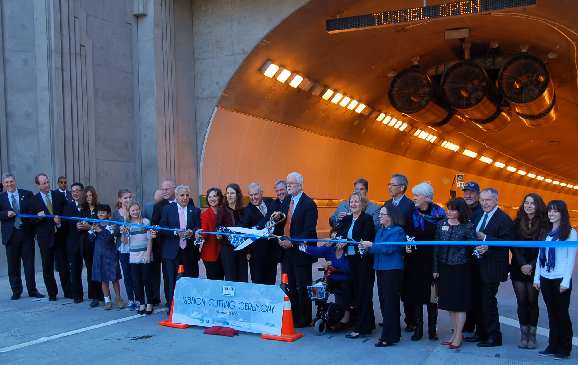  Group at ribbon cutting ceremony for new tunnel opening.