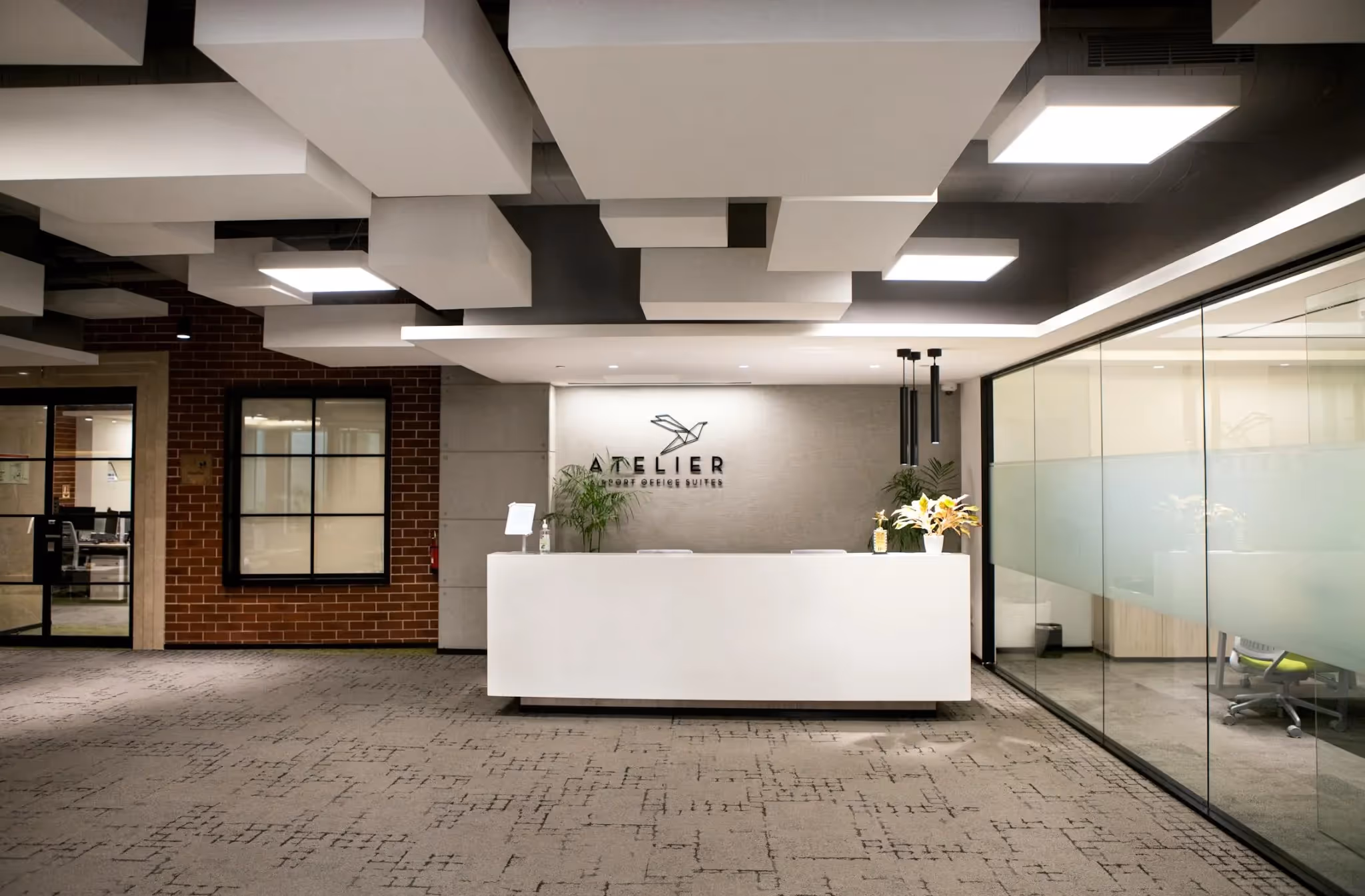 Category B fitout with furnished reception and acoustic ceiling panels.