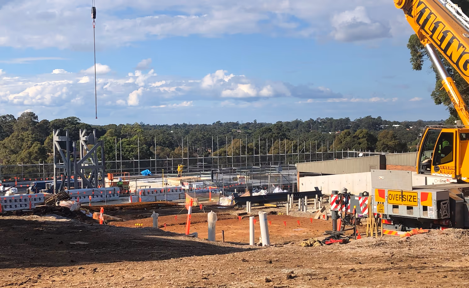 Construction progress of The Innovation Hub at Oakhill College with crane on site.