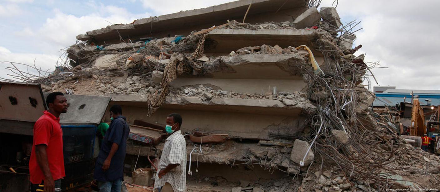 Emergency responders at the rubble of the Synagogue Church guesthouse in Nigeria after its sudden collapse in 2014.