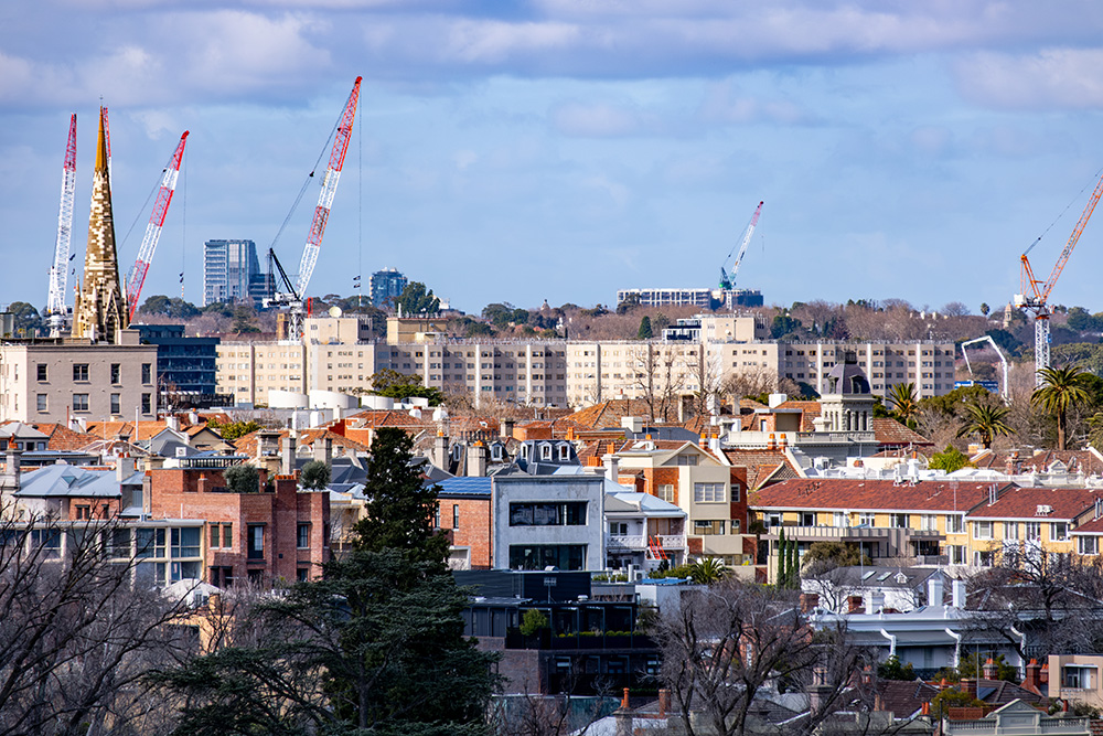 City view with cranes showing how to get into property development smartly.