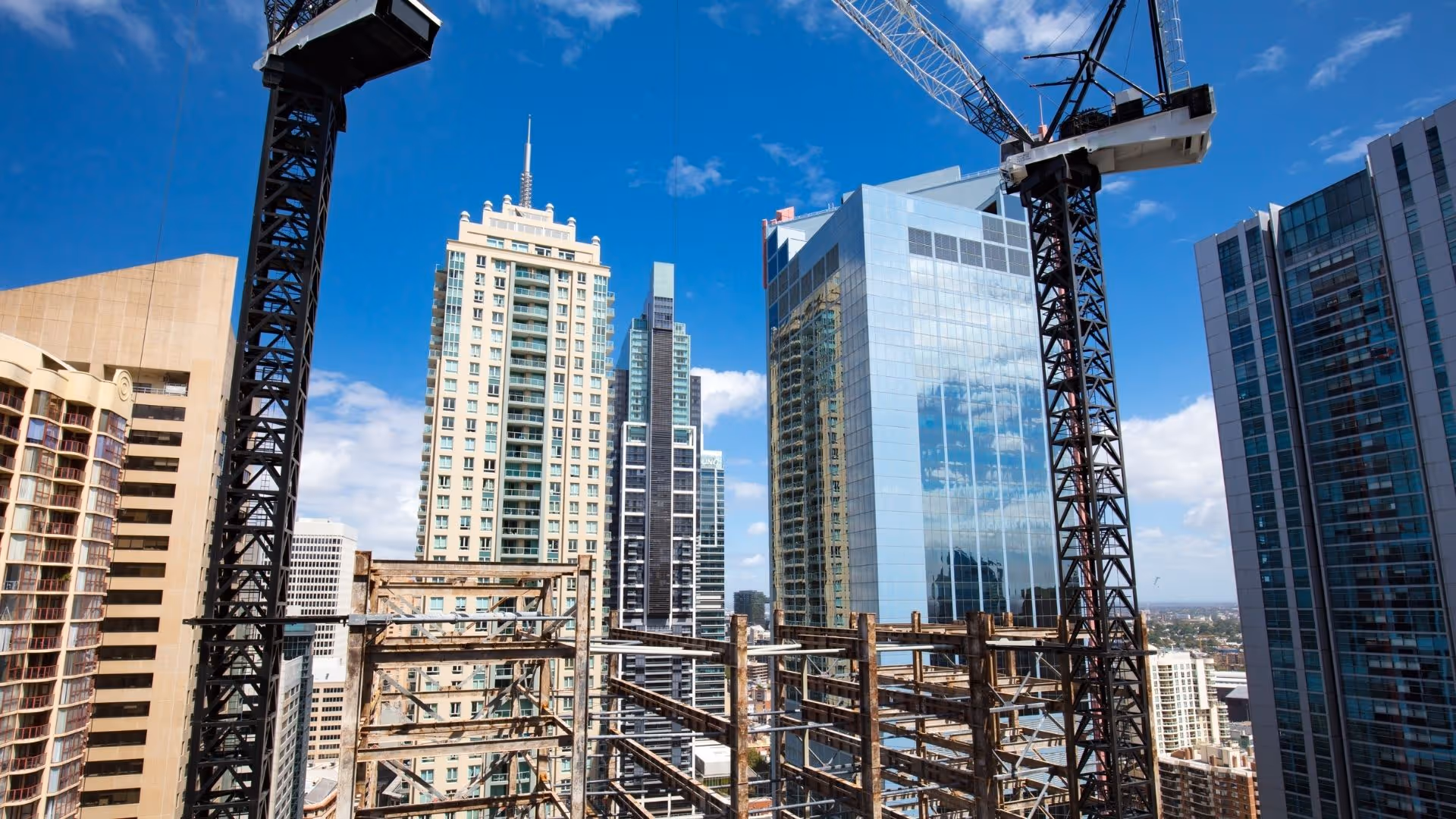 New commercial construction site with cranes and high-rise buildings