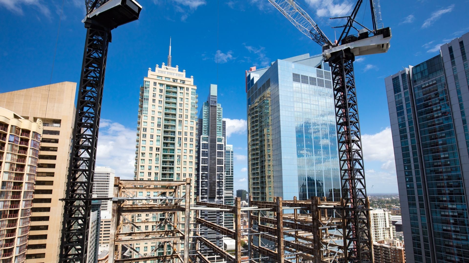 New commercial construction site with cranes and high-rise buildings