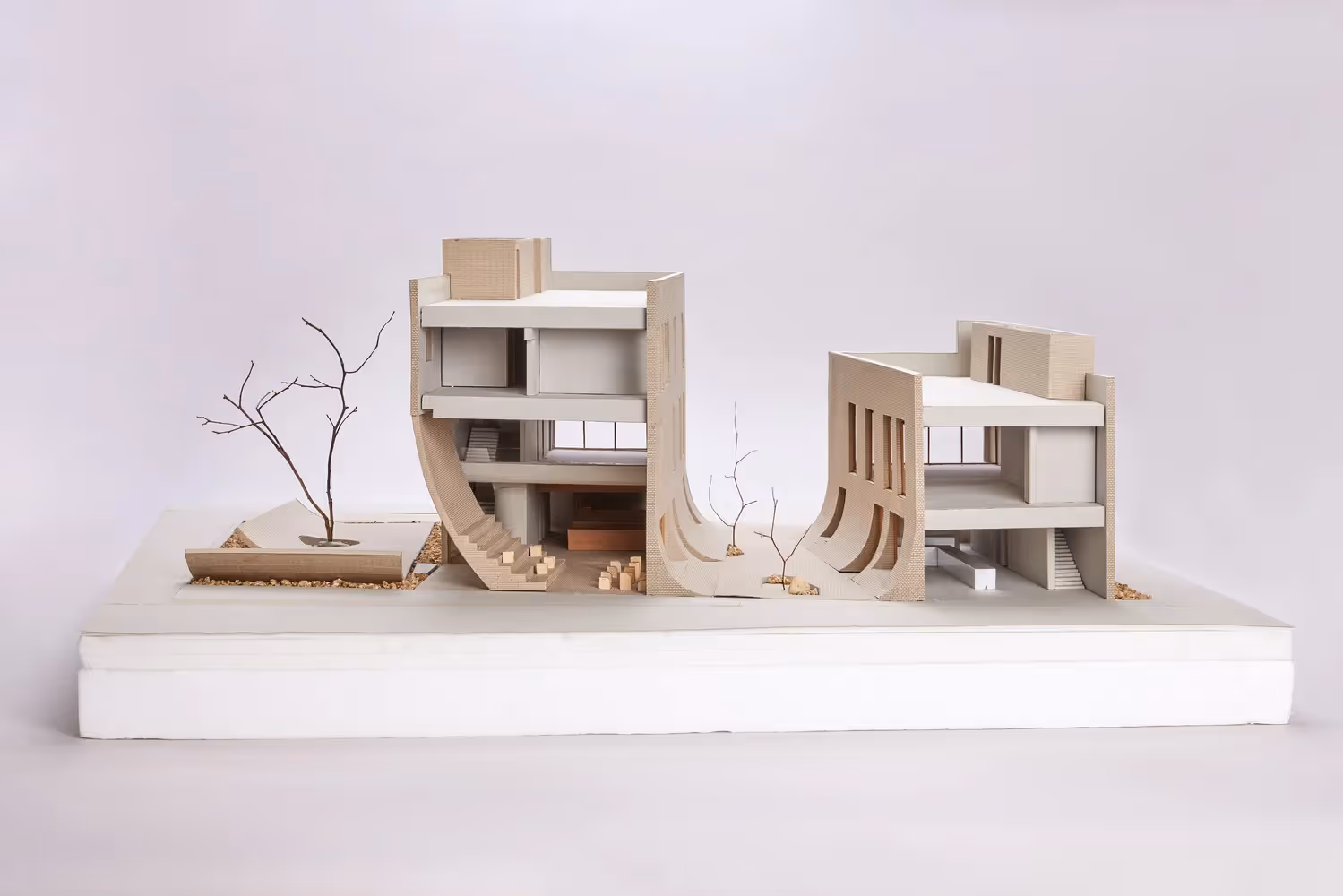 Minimal architectural model showcasing curved concrete design