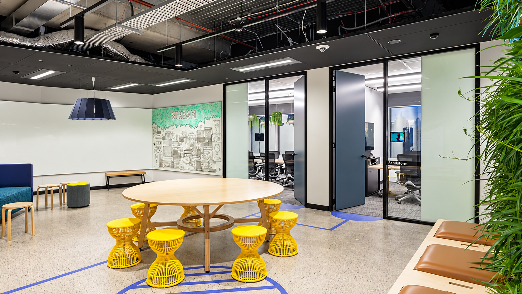 Atlassian George Street office interior with collaborative seating and meeting rooms.