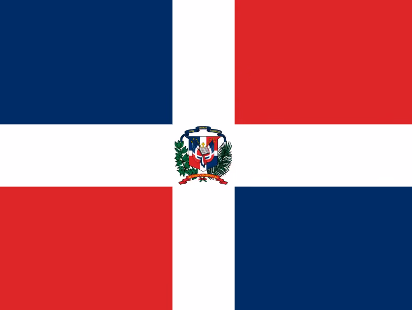 Dominican Republic flag with white cross, blue and red quarters, and coat of arms in center.