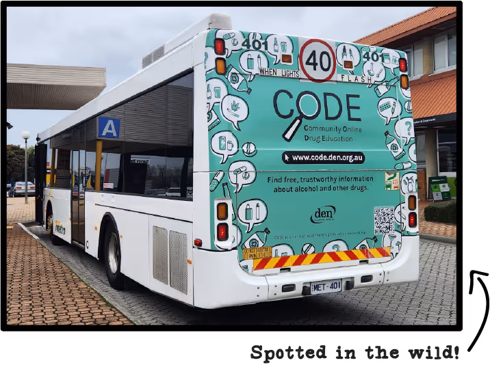 The back of a metro bus with a large advertisement for Community Online Drug Education. The background is green with many speech bubbles around the edge, with simply drawn images of drugs inside the bubbles. An arrow points to the photo, saying "Spotted in the wild!"