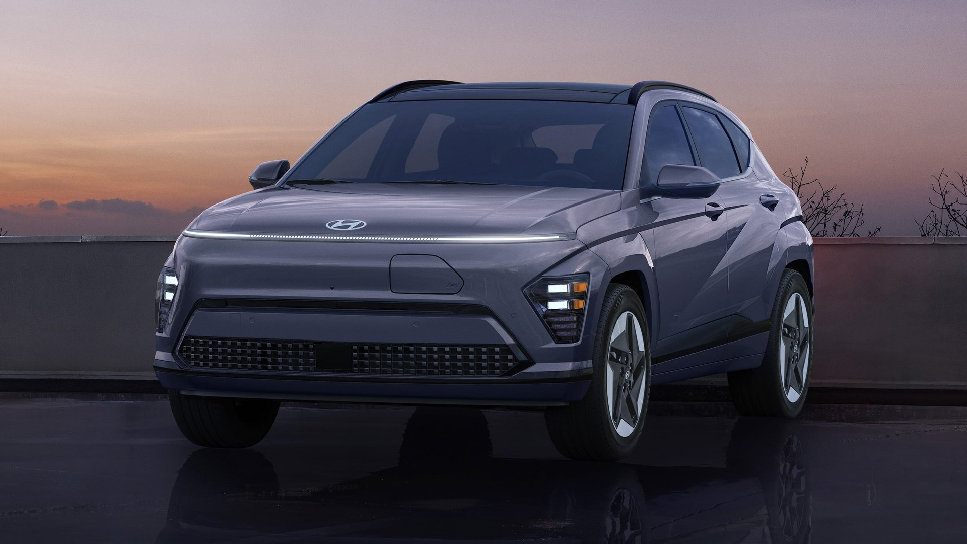 A 2026 Hyundai Kona Electric in white, three-quarter front view.